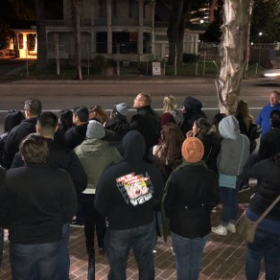 a group of people standing in front of a crowd