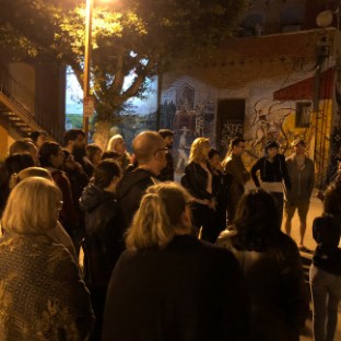 a group of people standing in front of a crowd