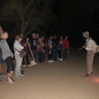 a group of people standing in front of a crowd