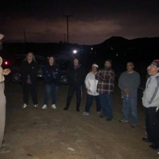 a group of people standing in front of a crowd