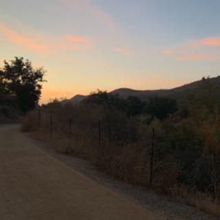 a sunset over a road