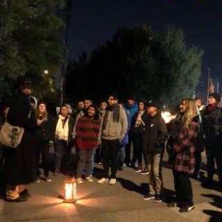 a group of people standing in front of a crowd