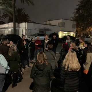 a group of people walking down the street