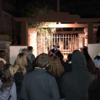 a group of people standing in front of a crowd