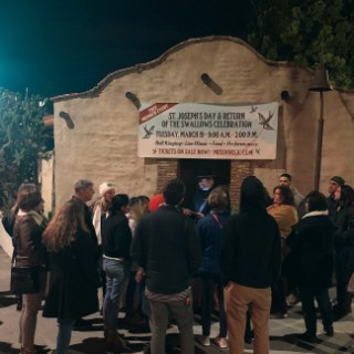 a group of people walking down the street