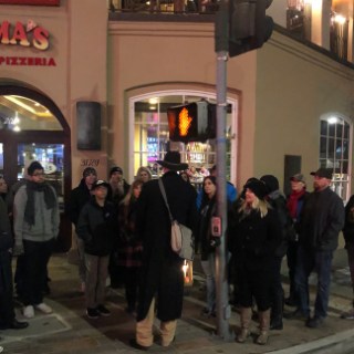 a group of people walking down the street