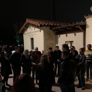 a group of people standing in front of a crowd