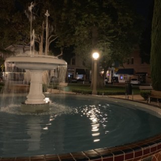 a fountain in the middle of the street