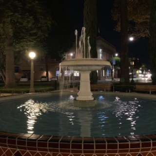 a fountain in front of a building