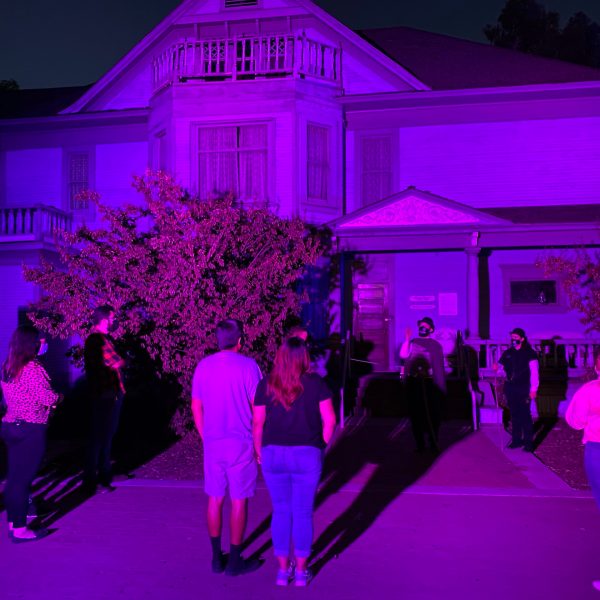 a group of people on a stage in front of a crowd