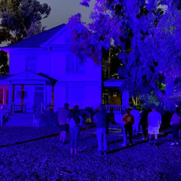 a group of people standing in front of a building