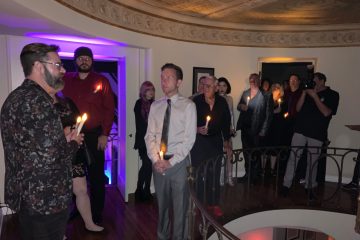 a group of people standing in a room