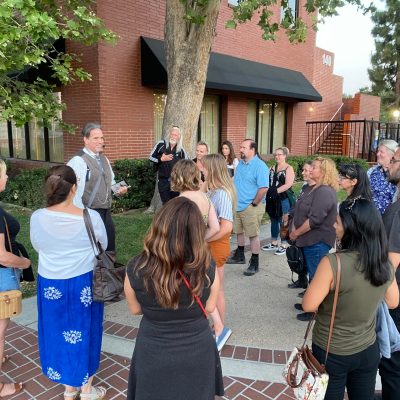 a group of people standing in front of a building