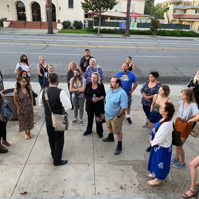 a group of people standing in a parking lot