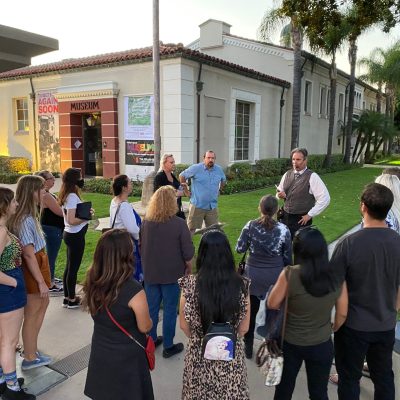 a group of people standing in front of a building
