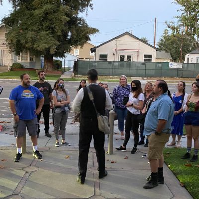 a group of people standing in front of a building
