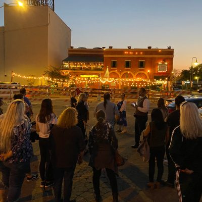 a group of people standing in front of a crowd