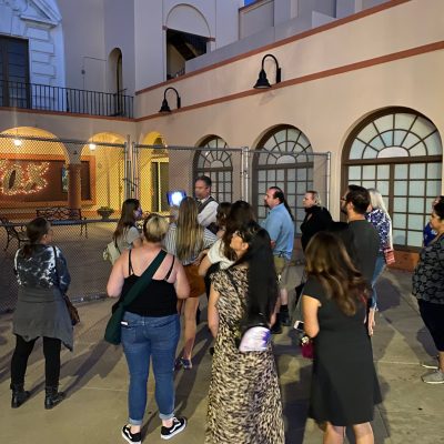 a group of people standing in front of a building