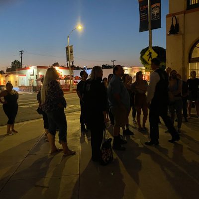 a group of people walking down the street