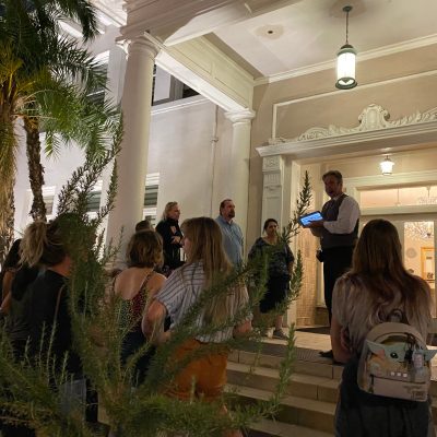 a group of people standing in front of a building