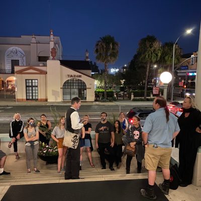 a group of people standing in front of a building