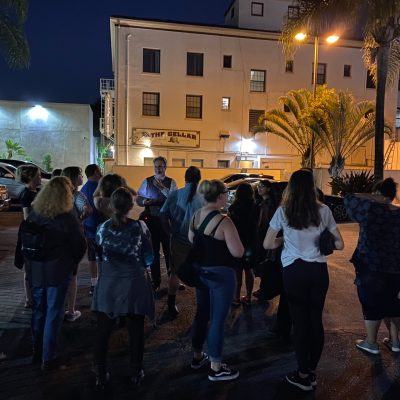 a group of people standing in front of a building