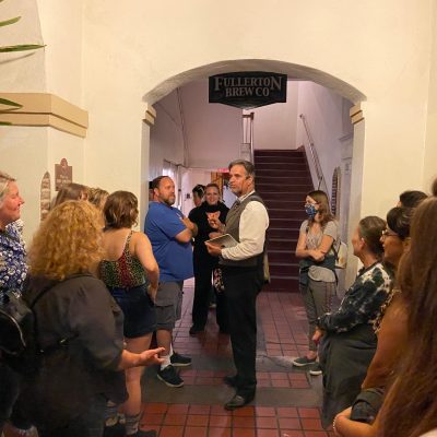 a group of people standing in front of a building