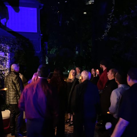 a group of people standing on a stage in front of a crowd