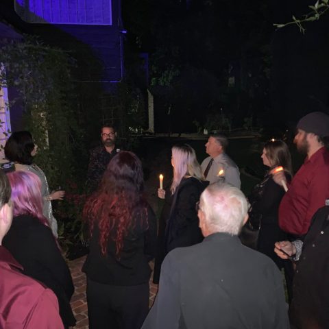 a group of people standing in front of a crowd