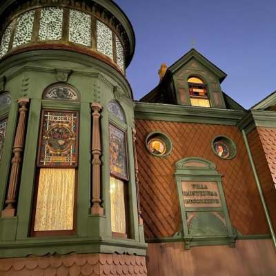 a church with a clock on the side of a building