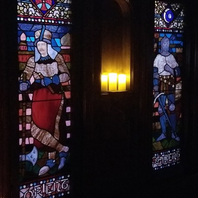 a couple of people that are standing in a dark room