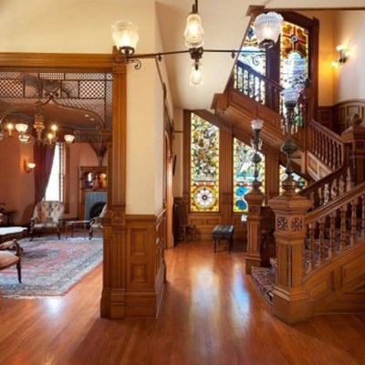 a living room filled with furniture on top of a hard wood floor