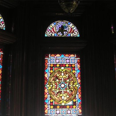 a group of people on a stage in front of a window