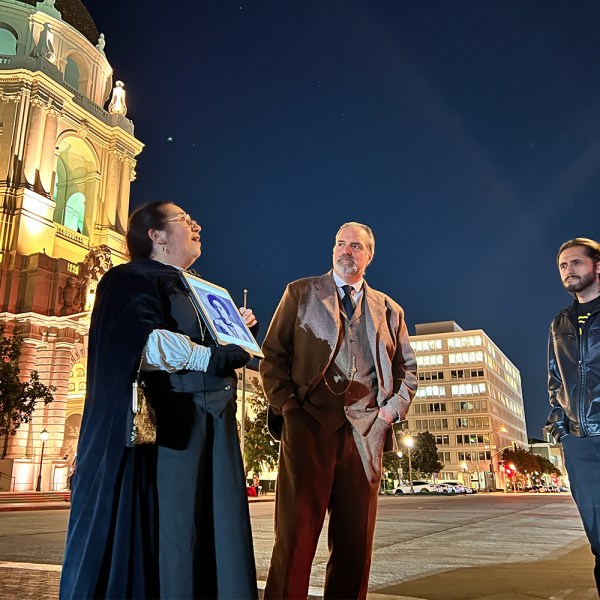 a group of people standing next to a person