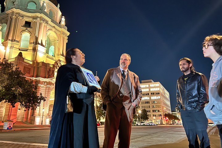 a group of people standing next to a person