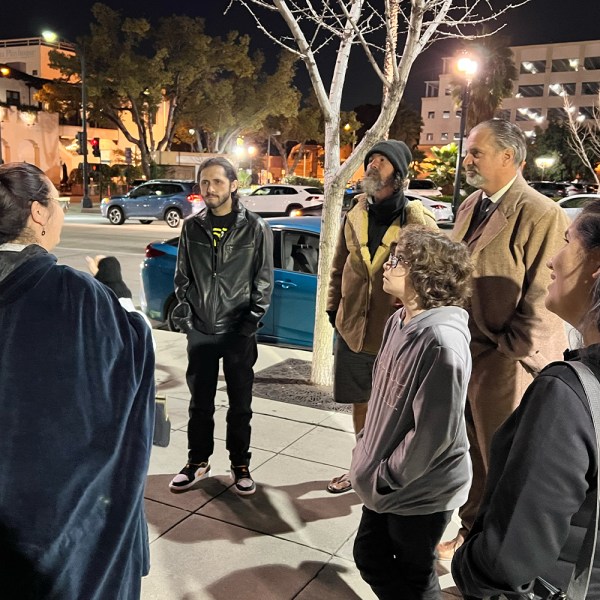a group of people standing in front of a crowd
