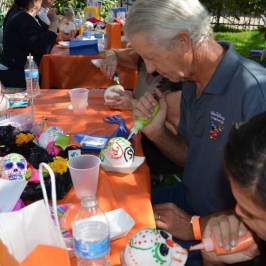 a group of people sitting at a table eating food