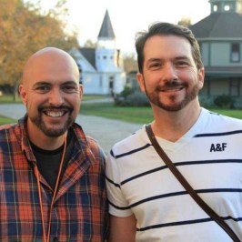 a man standing in front of a building