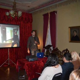 a group of people sitting around a living room