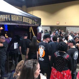 a group of people standing in front of a crowd