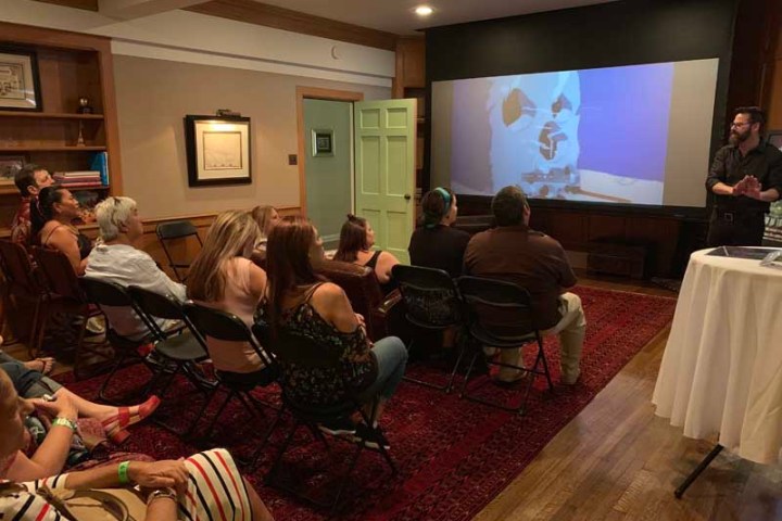 a group of people sitting around a living room