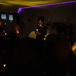 a group of people in a dark room