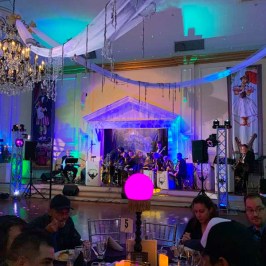 a group of people sitting on a stage