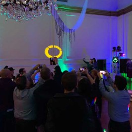 a group of people standing on a stage in front of a crowd