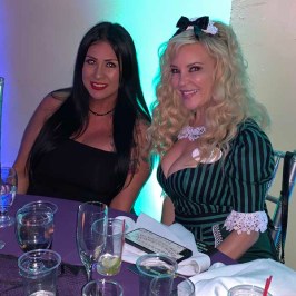 Bridget Marquardt sitting on a table