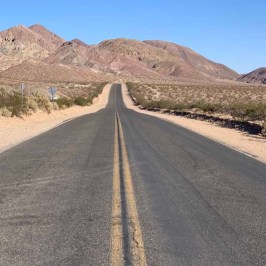 a close up of a desert road