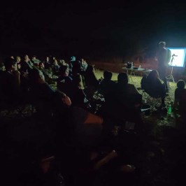 a group of people in a dark room