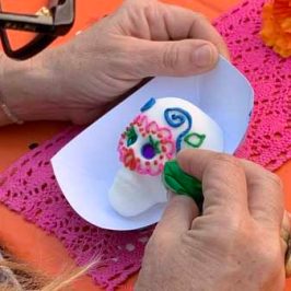 a hand holding a baby