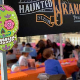 a person standing in front of a sign