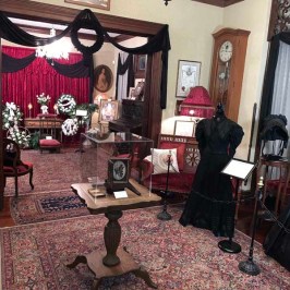 a living room filled with furniture and a fireplace